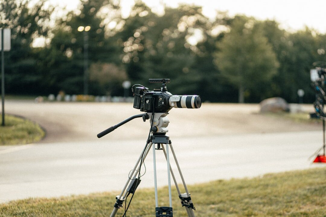 Professional broadcast camera mounted on a tripod in a television studio