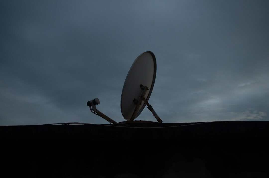 Satellite dish antenna for live signal uplink against the sky