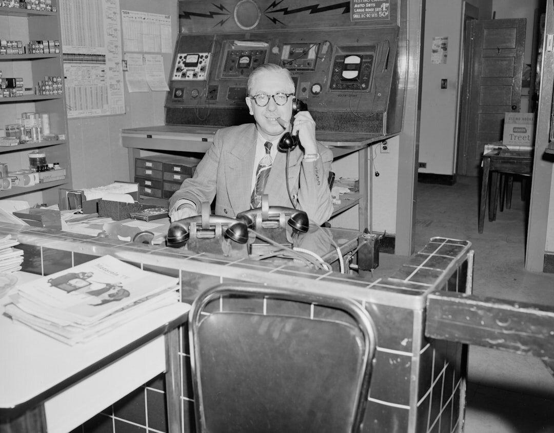 Modern television newsroom with desks and screens